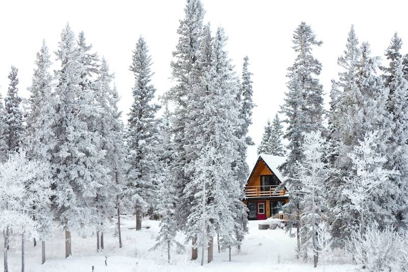 Mid-winter cottage inspection in Ontario after freeze-thaw conditions with snow-covered property